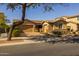 Inviting single-story home featuring a brick driveway, two-car garage, and landscaped front yard at 5054 S Advant Ter, Mesa, AZ 85212