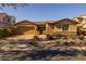 Charming single-story home with a well-maintained front yard and a two-car garage at 5054 S Advant Ter, Mesa, AZ 85212