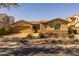 Charming single Gathering home featuring desert landscaping, stone accents, and a two-car garage at 5054 S Advant Ter, Mesa, AZ 85212