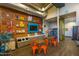 Fun, modern resident game room with retro decor, comfortable seating, and a vending machine at 5054 S Advant Ter, Mesa, AZ 85212