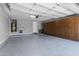 Spacious garage with built-in storage cabinets, providing ample space for vehicles and organization at 5054 S Advant Ter, Mesa, AZ 85212