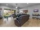 Spacious living room with tile flooring and sliding glass doors to backyard at 5054 S Advant Ter, Mesa, AZ 85212