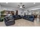 Open living room featuring tile floors, ceiling fan, and view to the kitchen and dining room at 5054 S Advant Ter, Mesa, AZ 85212