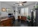 This home office features a dark wood floor and ample desk space at 5054 S Advant Ter, Mesa, AZ 85212