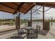 Outdoor seating area offering views of the community pond and walking trails at 5054 S Advant Ter, Mesa, AZ 85212