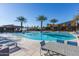 Relaxing community pool area with comfortable lounge chairs and tables for residents at 5054 S Advant Ter, Mesa, AZ 85212
