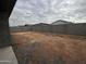 The backyard features a block wall, dirt, and new construction next door at 5615 W Summerside Rd, Laveen, AZ 85339