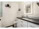 Modern bathroom boasts a sleek vanity with a dark countertop, an illuminated mirror, and stylish fixtures at 5641 E Aster Dr, Scottsdale, AZ 85254