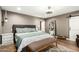 Spacious primary bedroom with a bench and a large mirror at 5641 E Aster Dr, Scottsdale, AZ 85254