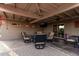 Comfortable covered patio features ceiling fans, a TV, and stylish seating, perfect for relaxing and entertaining outdoors at 5641 E Aster Dr, Scottsdale, AZ 85254