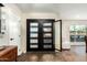 Bright entryway with modern black double doors and seamless access to other rooms at 5641 E Aster Dr, Scottsdale, AZ 85254