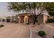 Attractive single-story home with mature landscaping, welcoming entrance, and eye-catching curb appeal at 5641 E Aster Dr, Scottsdale, AZ 85254