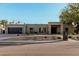 Stunning single-story home boasts modern architecture, low maintenance desert landscaping, and private garage at 5641 E Aster Dr, Scottsdale, AZ 85254