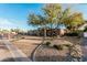 Gorgeous single-story home boasts desert landscaping, a modern garage door, and a private gated entry at 5641 E Aster Dr, Scottsdale, AZ 85254