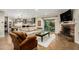 Spacious open living room with view to the kitchen and a beautiful stone fireplace at 5641 E Aster Dr, Scottsdale, AZ 85254