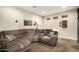 Comfortable living room featuring a large sectional sofa, unique decor, and ample seating at 5641 E Aster Dr, Scottsdale, AZ 85254