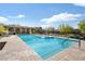 Community pool featuring a spa, plenty of lounge chairs, and shaded seating area at 7340 E Conquistadores Dr, Scottsdale, AZ 85255