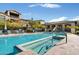 Community pool with spa, lounge chairs, covered seating, and well-maintained landscaping at 7340 E Conquistadores Dr, Scottsdale, AZ 85255