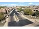 Aerial view of a gated community with meticulously landscaped grounds and well-maintained homes at 7340 E Conquistadores Dr, Scottsdale, AZ 85255