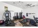 Well-equipped gym with machines, weights, and carpeted floors, illuminated by natural light from multiple windows at 7340 E Conquistadores Dr, Scottsdale, AZ 85255