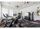 Bright exercise room featuring a variety of modern equipment, ceiling fans and large windows at 7340 E Conquistadores Dr, Scottsdale, AZ 85255