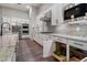 Well-appointed kitchen with white cabinets, stainless steel appliances, and a functional design for efficient meal preparation at 7340 E Conquistadores Dr, Scottsdale, AZ 85255