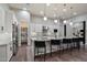 Modern kitchen featuring stainless steel appliances, granite countertops, and seamless access to a pantry and adjacent rooms at 7340 E Conquistadores Dr, Scottsdale, AZ 85255