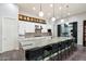 Modern kitchen boasts granite countertops, stainless steel appliances, and stylish pendant lighting at 7340 E Conquistadores Dr, Scottsdale, AZ 85255