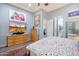 Spacious main bedroom with modern decor, a ceiling fan, and a picturesque window view at 7340 E Conquistadores Dr, Scottsdale, AZ 85255