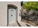 Stone and tile outdoor shower surrounded by professional landscaping at 7340 E Conquistadores Dr, Scottsdale, AZ 85255