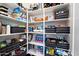 Organized pantry features ample shelving and storage baskets for kitchen essentials at 7340 E Conquistadores Dr, Scottsdale, AZ 85255