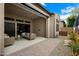 Spacious outdoor patio with comfortable seating, landscaping, and views of the backyard at 7340 E Conquistadores Dr, Scottsdale, AZ 85255
