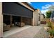 Covered outdoor patio featuring comfortable seating and a retractable shade screen at 7340 E Conquistadores Dr, Scottsdale, AZ 85255