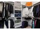 This walk-in closet has custom shelving, hanging racks, and lots of storage at 7340 E Conquistadores Dr, Scottsdale, AZ 85255