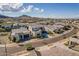 A real estate aerial view of a modern desert community set against a mountain backdrop at 921 E Buist Ave, Phoenix, AZ 85042