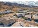 A real estate aerial view of a modern desert community set against a mountain backdrop at 921 E Buist Ave, Phoenix, AZ 85042
