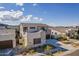 Elevated side view of a modern stucco home with desert landscaping and a neutral-colored roof at 921 E Buist Ave, Phoenix, AZ 85042