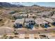 A real estate aerial view of a modern desert community set against a mountain backdrop at 921 E Buist Ave, Phoenix, AZ 85042