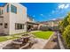 Spacious, modern backyard with artificial turf, a seating area, and mountain views, perfect for outdoor relaxation at 921 E Buist Ave, Phoenix, AZ 85042