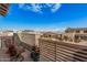 A cozy balcony with comfortable seating and views of the surrounding neighborhood and bright blue skies at 921 E Buist Ave, Phoenix, AZ 85042