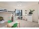 Bright bedroom with unique bunk bed, stylish desk area, and plenty of space for play and creativity at 921 E Buist Ave, Phoenix, AZ 85042