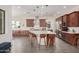 Updated kitchen boasts a large center island, stainless steel appliances, and plenty of storage space at 921 E Buist Ave, Phoenix, AZ 85042