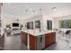 Bright kitchen with an island that offers seating and stainless steel appliances, perfect for entertaining at 921 E Buist Ave, Phoenix, AZ 85042