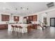 Open-concept kitchen boasts a center island, stainless appliances, and seamless flow to the living area at 921 E Buist Ave, Phoenix, AZ 85042
