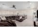 Spacious second-story living area with neutral paint, a sectional sofa, and a sliding glass door to a private balcony at 921 E Buist Ave, Phoenix, AZ 85042