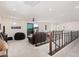 Spacious second-story living area with neutral paint and a sliding glass door that leads to a private balcony at 921 E Buist Ave, Phoenix, AZ 85042