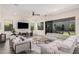 Bright living room with sliding glass doors to the backyard and patio at 921 E Buist Ave, Phoenix, AZ 85042