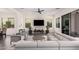 Contemporary living room with modern furniture and a large flat-screen TV at 921 E Buist Ave, Phoenix, AZ 85042