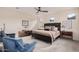 Spacious bedroom with accent chairs, dresser, and contemporary decor at 921 E Buist Ave, Phoenix, AZ 85042