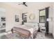 Serene main bedroom with a modern bed, soft lighting, and stylish decor for a relaxing atmosphere at 921 E Buist Ave, Phoenix, AZ 85042